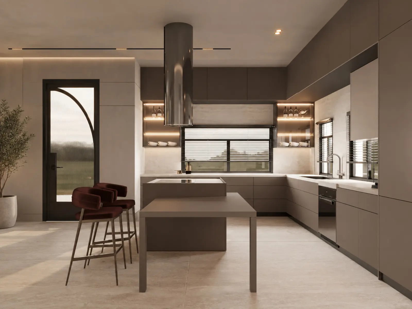 Vue d’ensemble de la cuisine taupe avec îlot central et hotte cylindrique