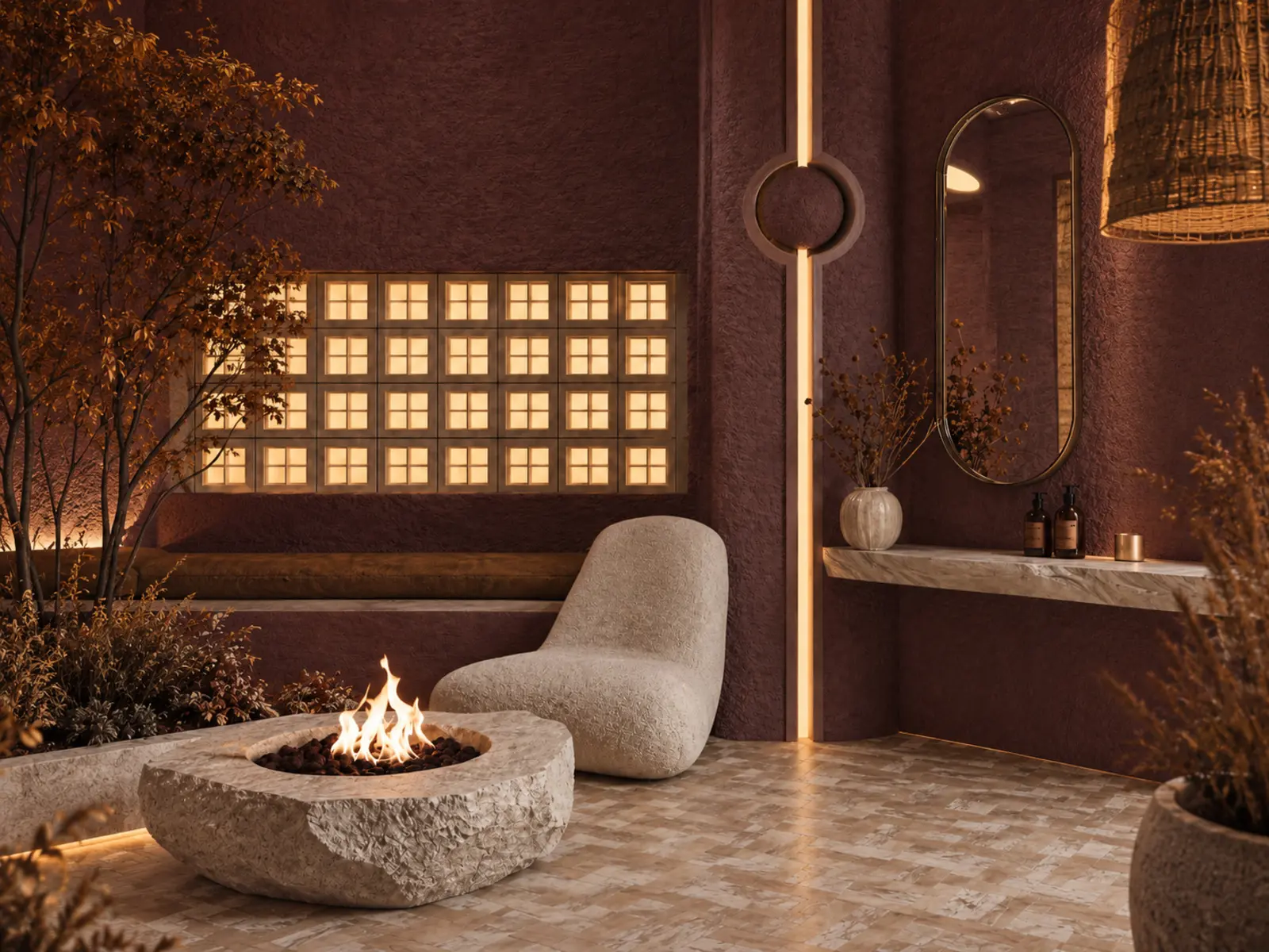 Détail du salon bien-être avec foyer en pierre, fauteuil sculptural et pavés de verre